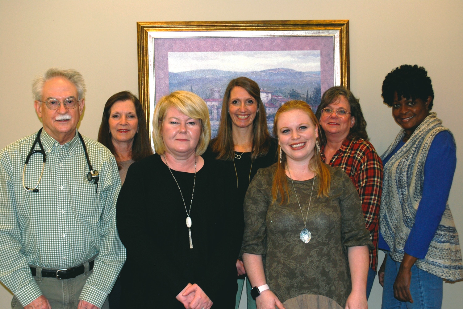 a group of people posing for the camera